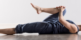 Women on back with one leg to chest